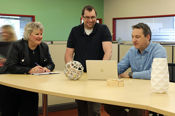 sales executives discussing a new project with the creative director